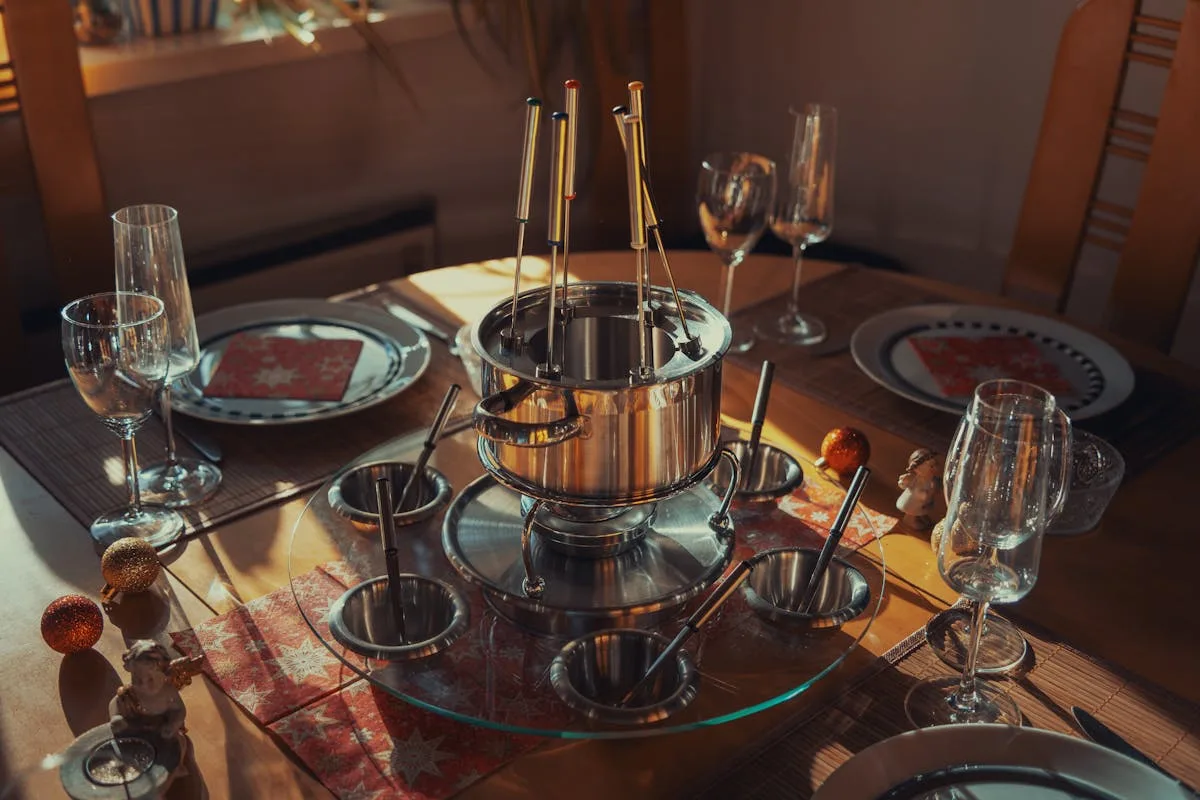 Empty Fondue Set, Plates and Glasses on a Table